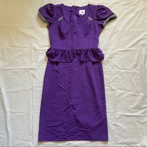 Purple rockabilly form fitting dress with peplum